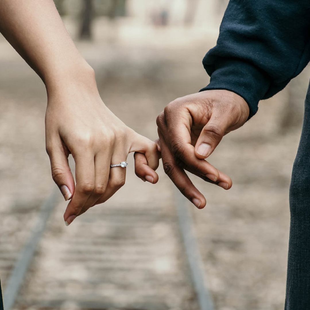 Engagement announcement picture holding hands showing off the engagement ring