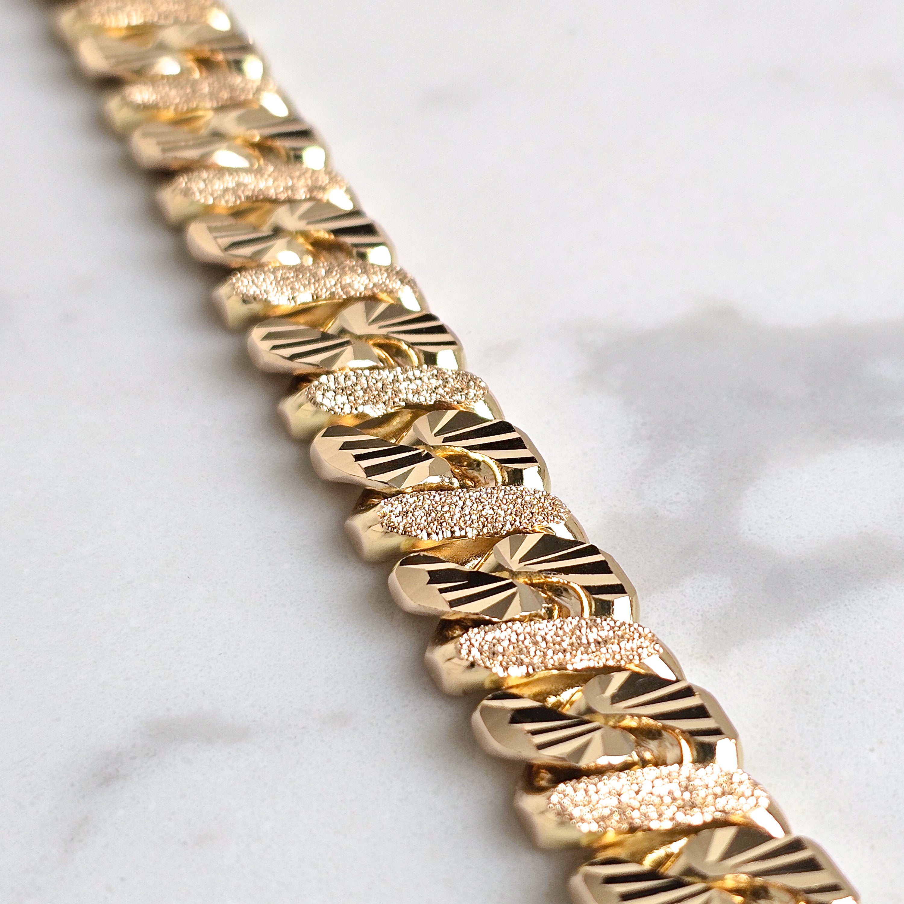 close up detail picture of diamond cut mens chain jewellery