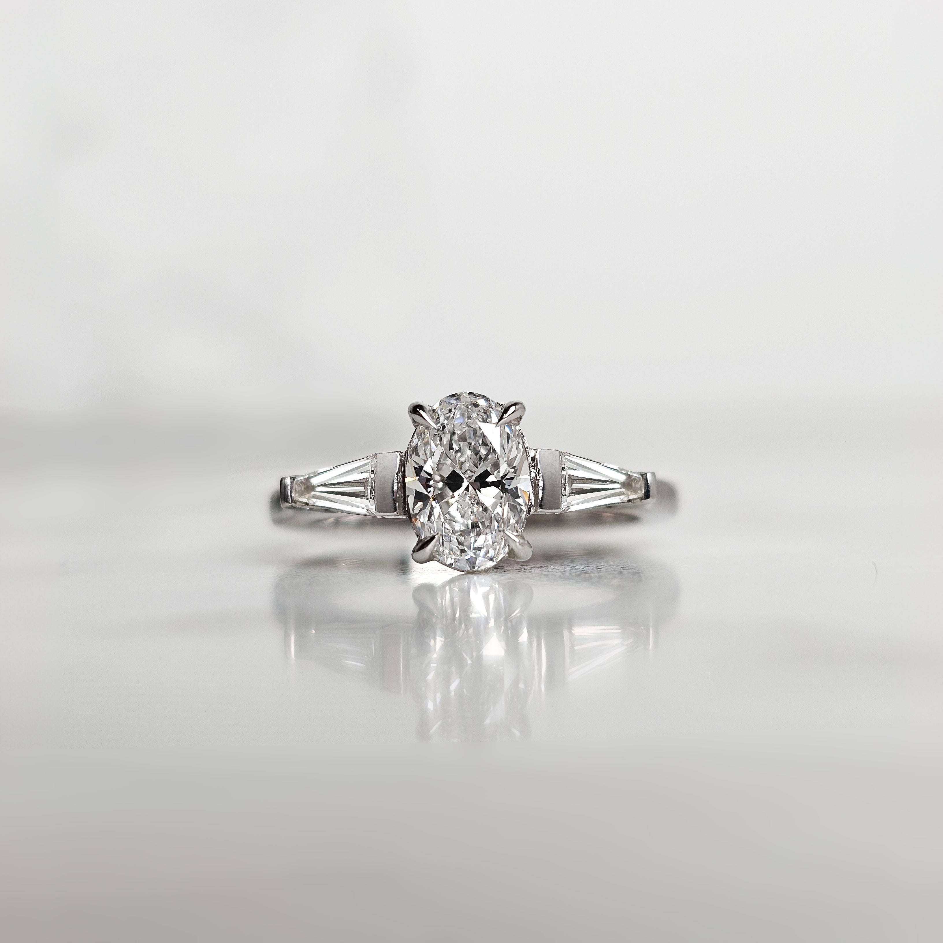 Oval and Trapezoid Trilogy Engagement Ring