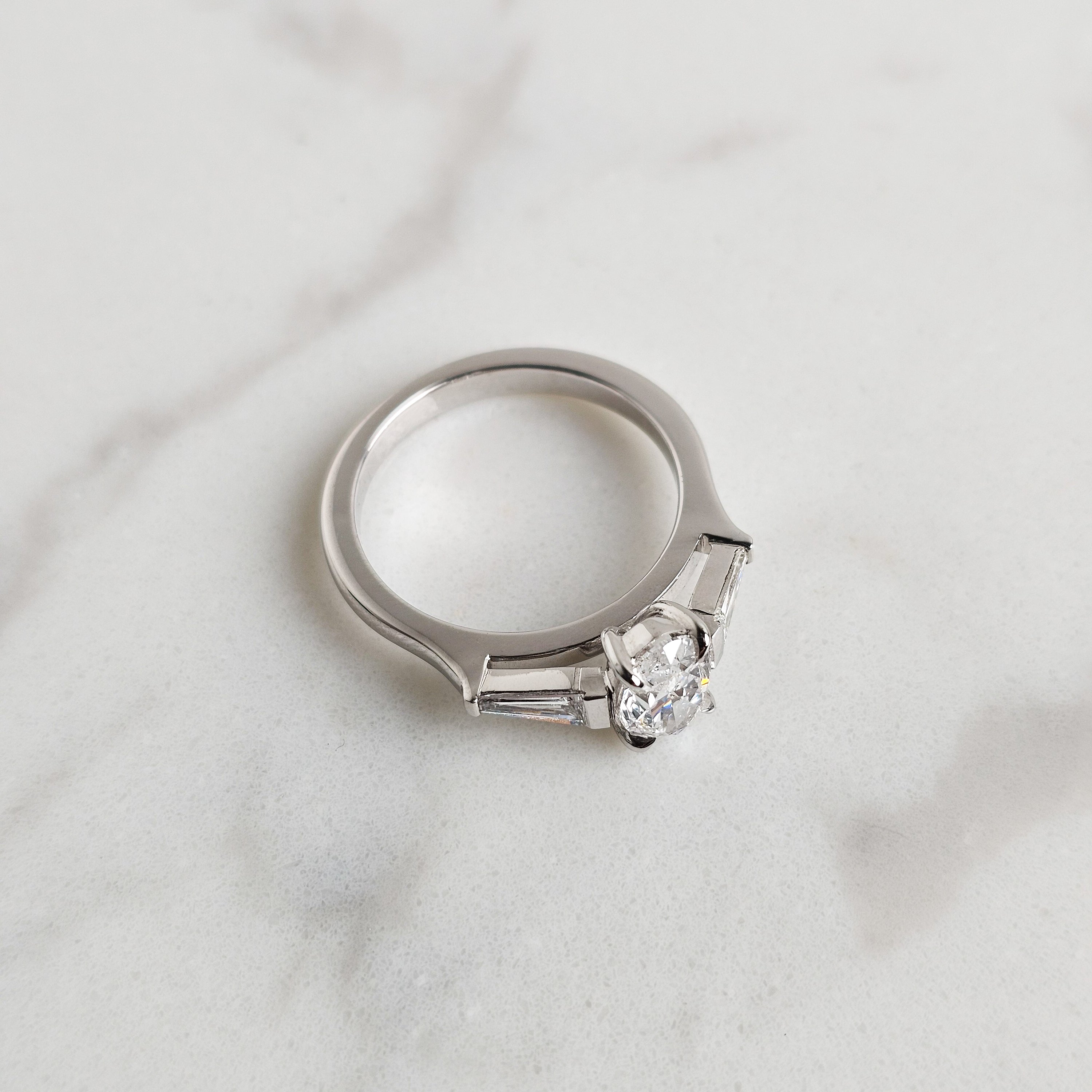 Oval and Trapezoid Trilogy Engagement Ring