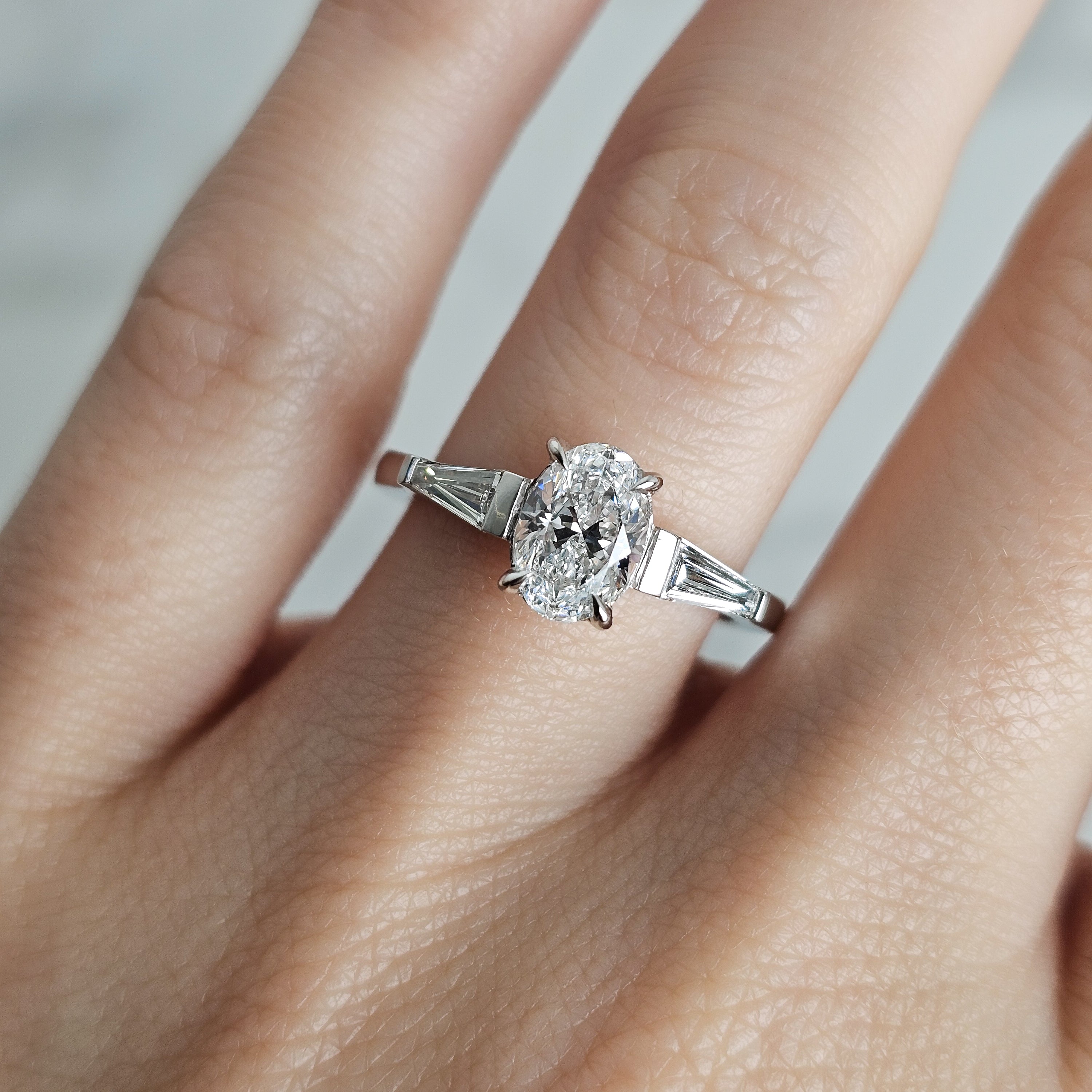 Oval and Trapezoid Trilogy Engagement Ring