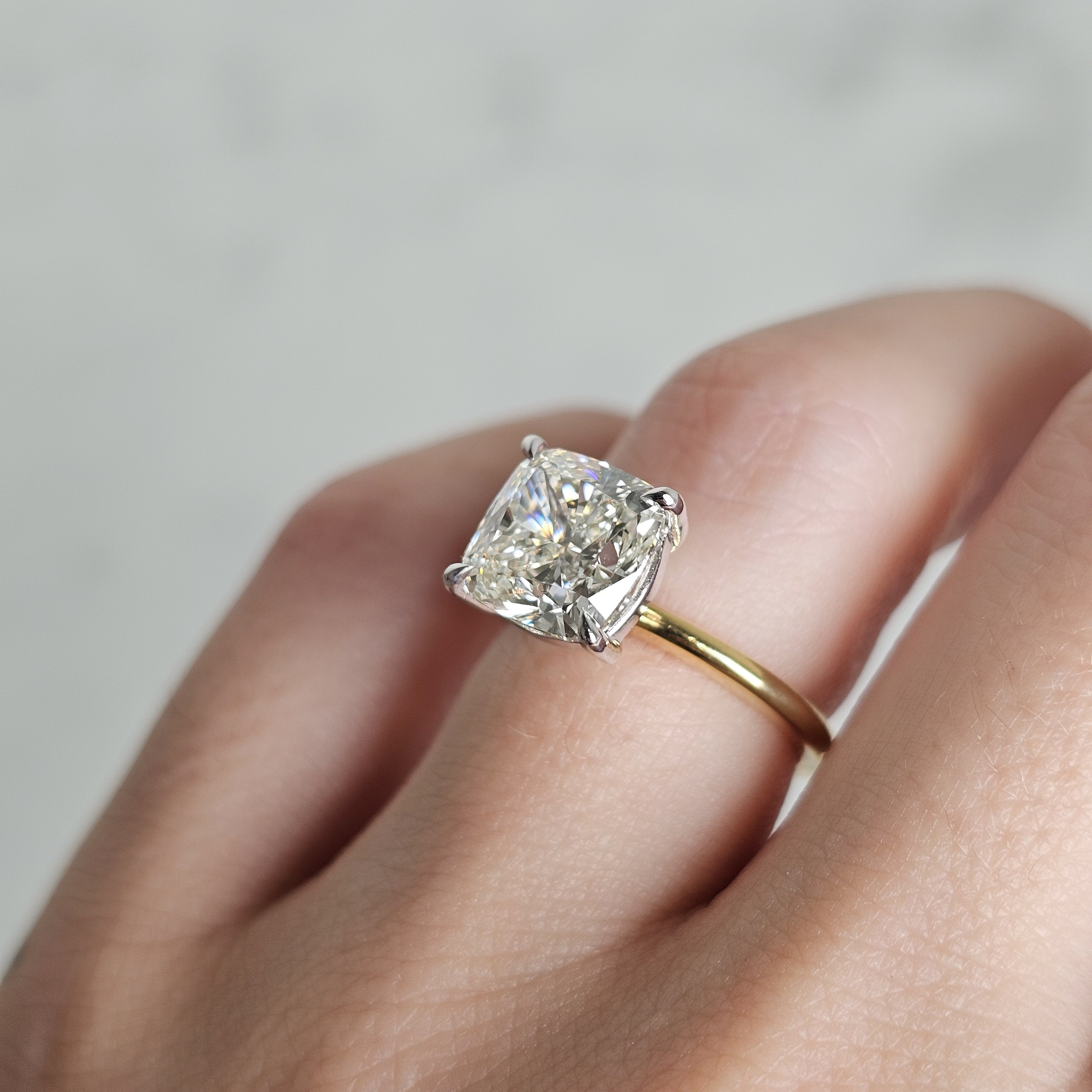 Cushion Cut Solitaire Ring 3.50ct Diamond in a two tone setting on hand