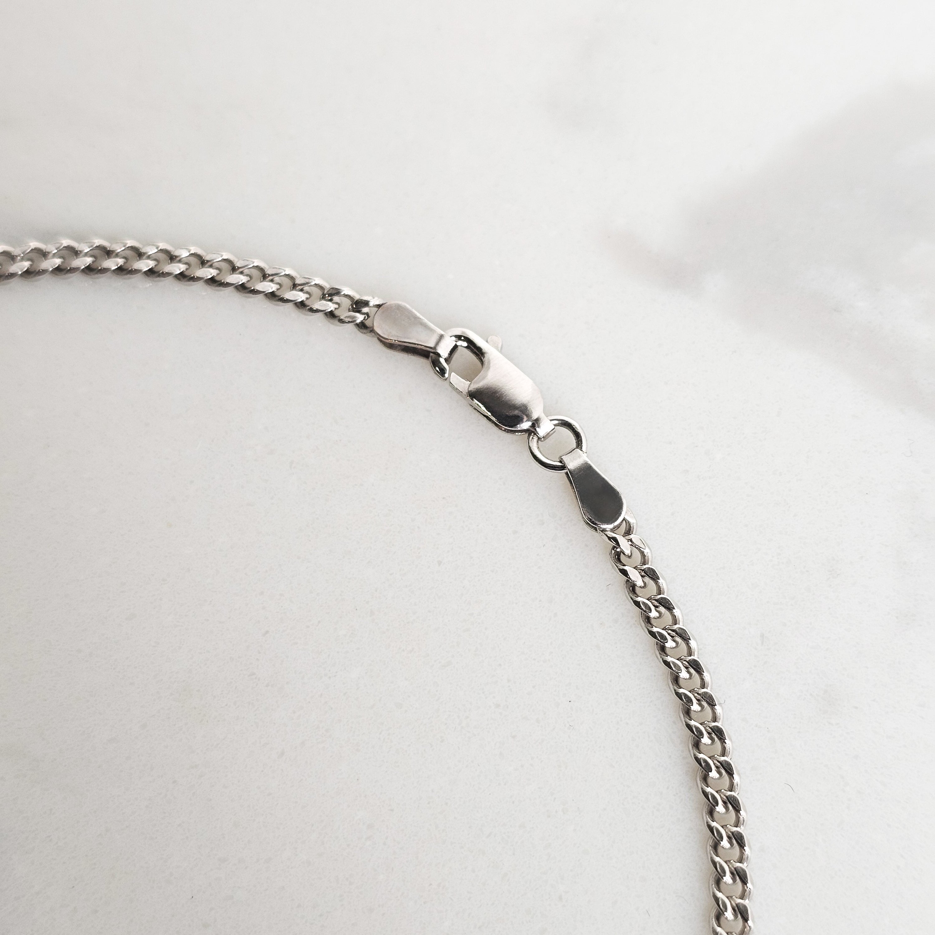 close up white gold micro cuban parrot clasp