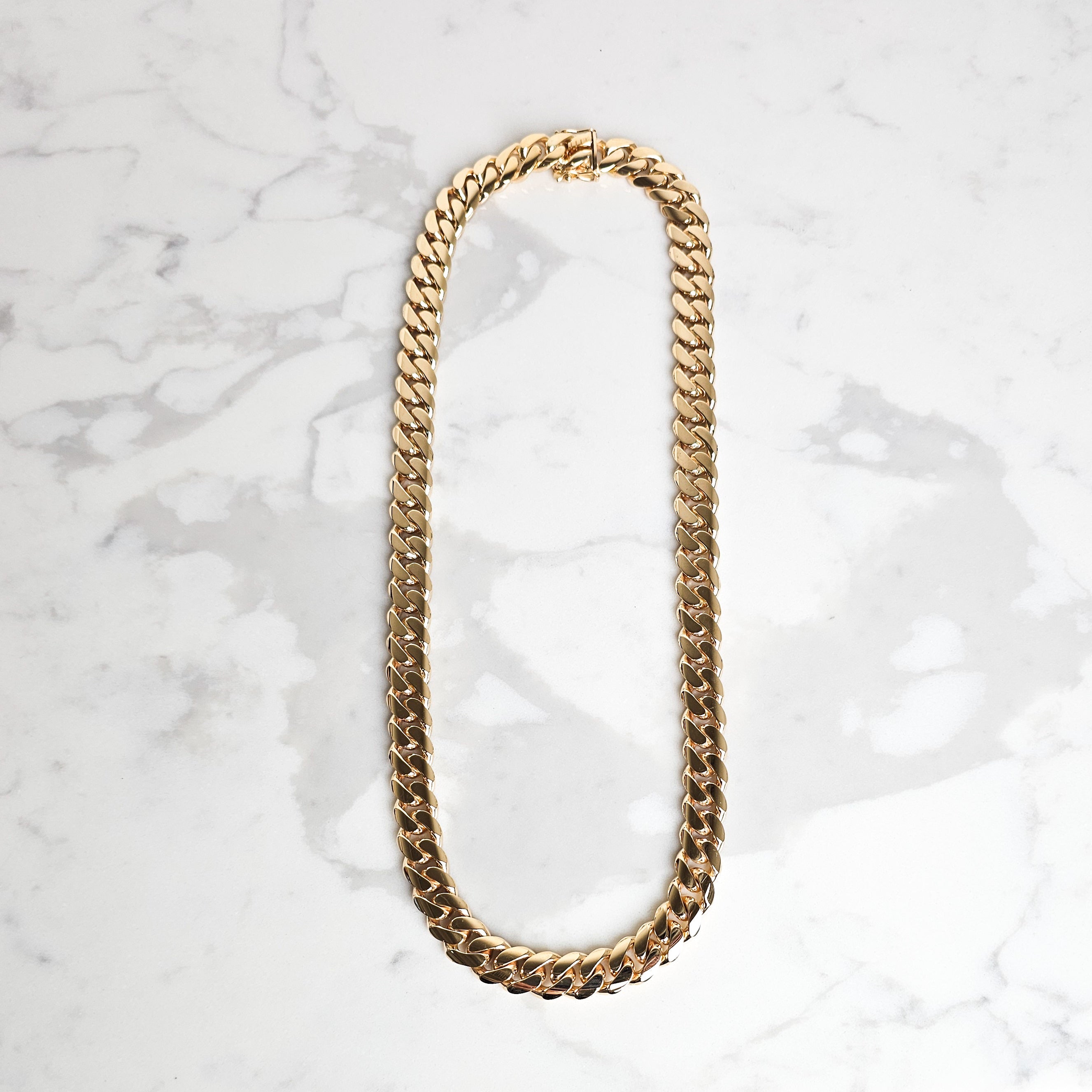 mens chain on marble 